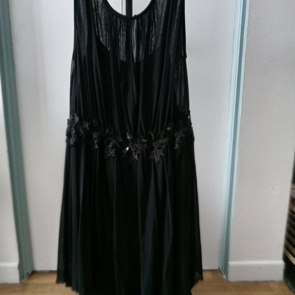 Beautiful black dress with embroidered and sequined belt, petticoat, and button